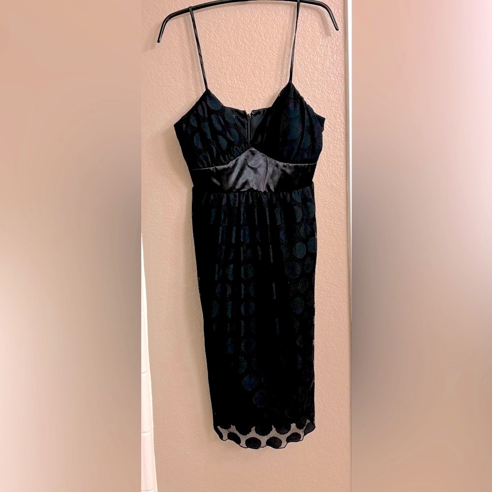 Black party dress. About 30 inches long, should hit just above knee.